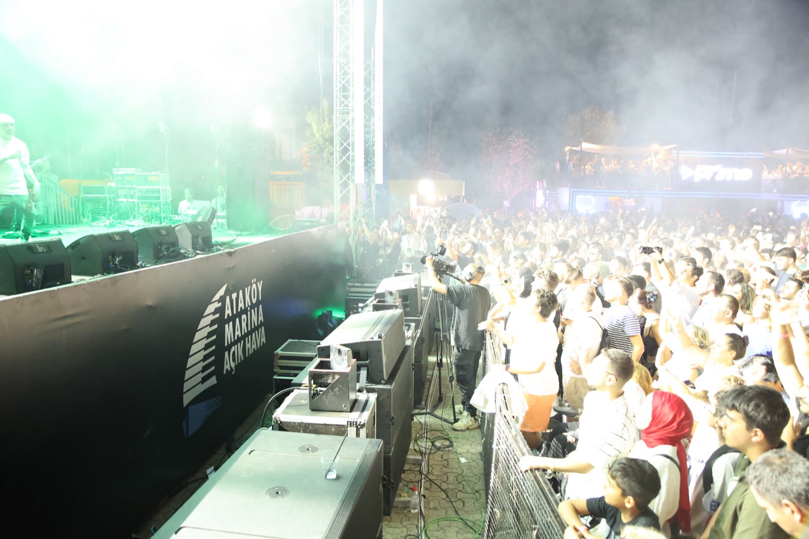 The stage seen from the side over the audience